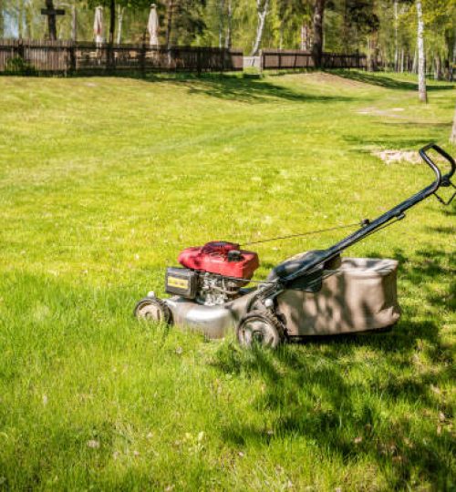 Professional lawn mower on lush green grass
